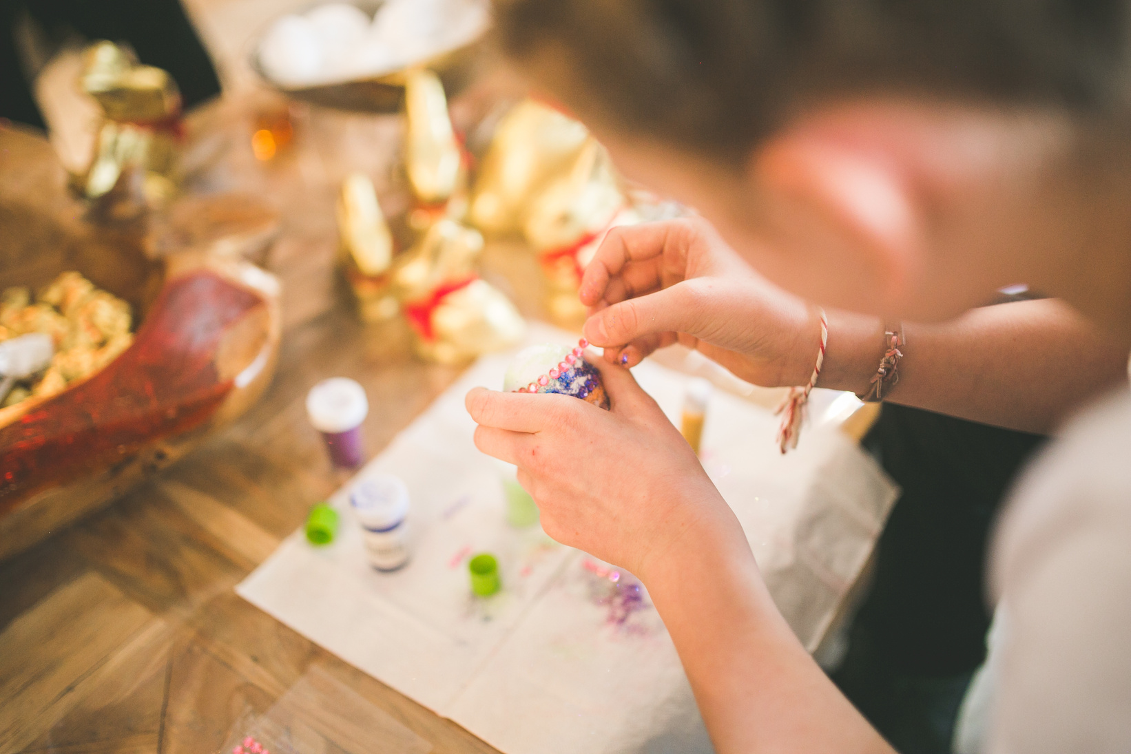 Close up of girl hands coloring eggs for easter II